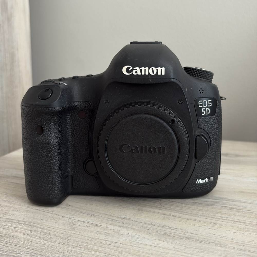 Canon Mark 3 with memory cards, strap, cords, battery and charger and manuals.